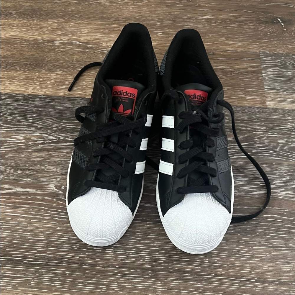 Adidas women  Black Sneakers with White Stripes